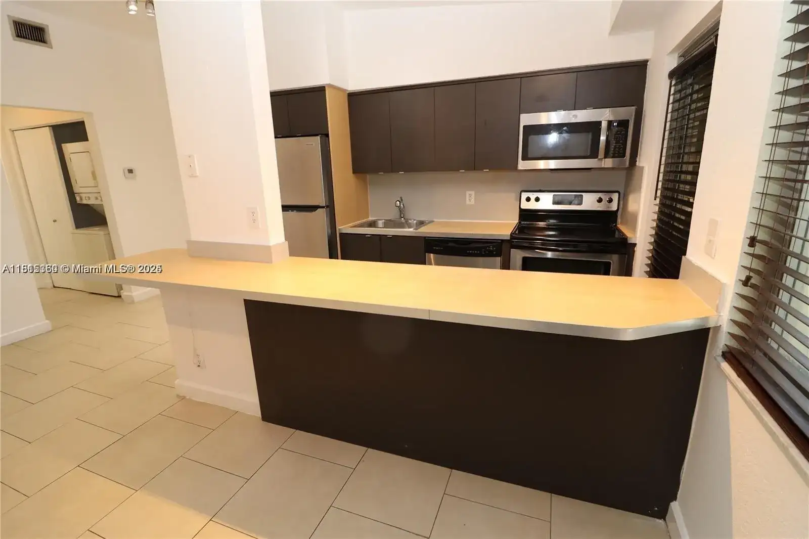 6835 RUE VERSAILLES # 104, Miami Beach FL 33141 photo 5