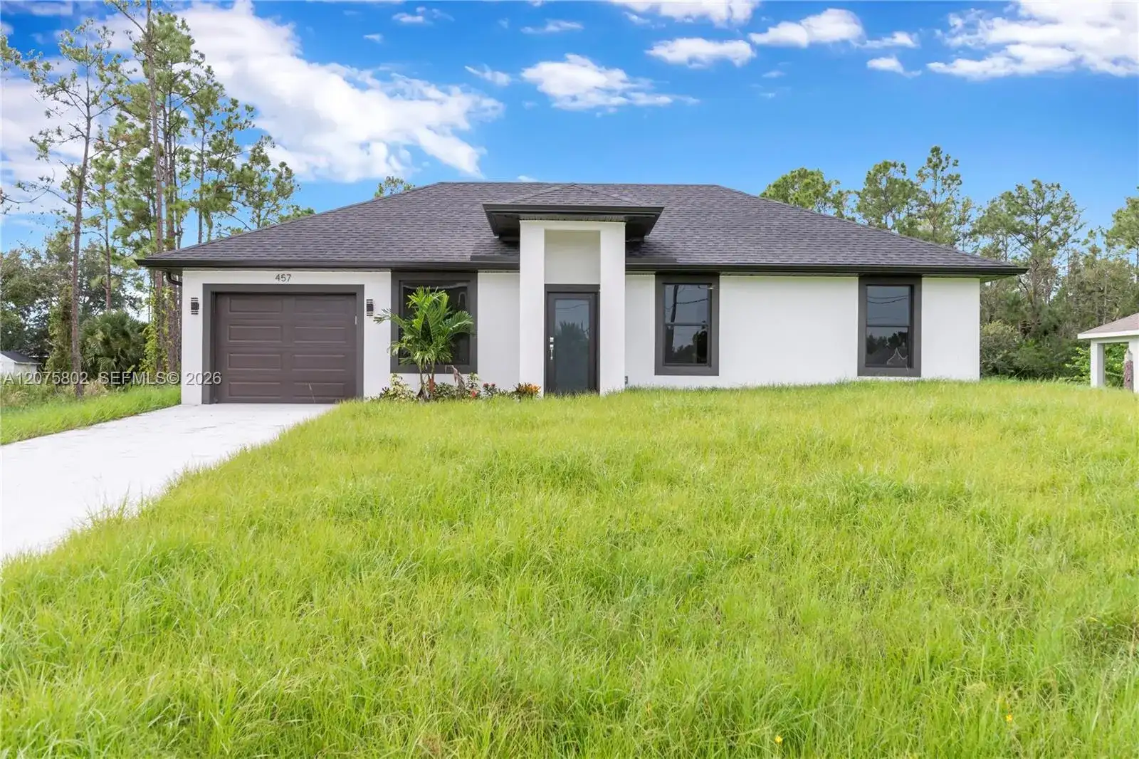 457 Woodman DR, Lehigh Acres FL 33972 photo 2