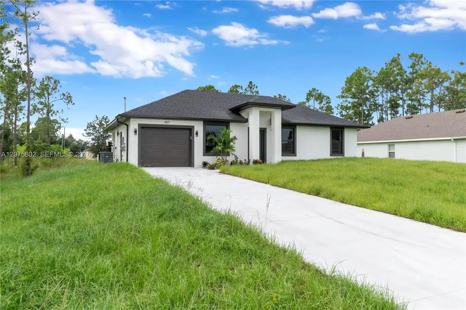 457 Woodman DR, Lehigh Acres FL 33972 photo 3