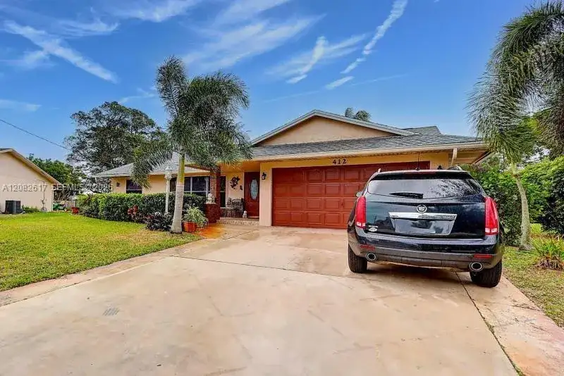 412 SW Sansom Ln, Port St. Lucie FL 34953 photo 2