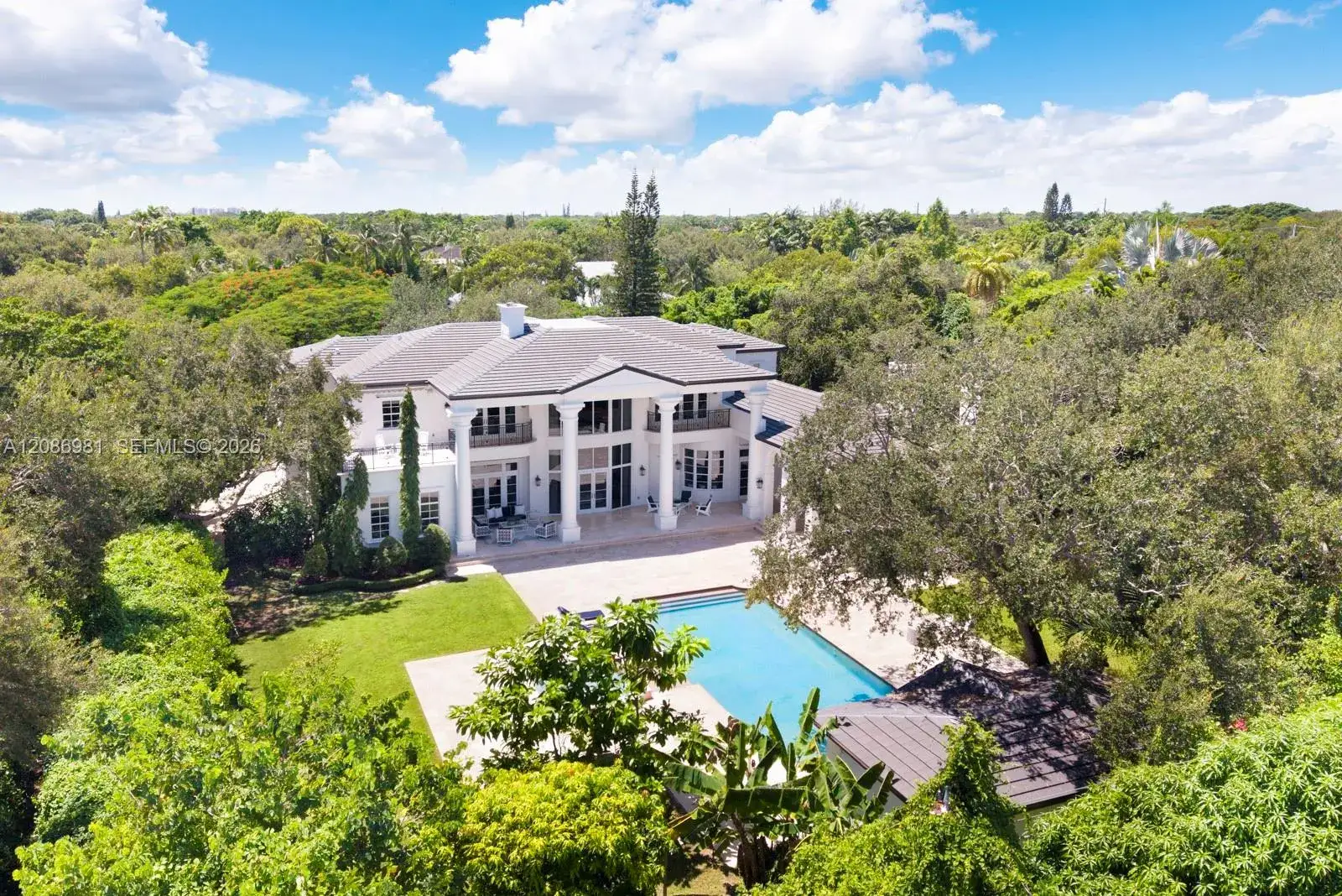 7 bedroom 8 bath Residential for sale at 6045 SW 106th St, Pinecrest FL 33156