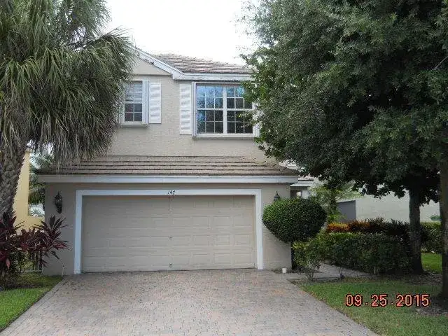4 bedroom 2 bath Residential for sale at 147 KENSINGTON Way, Royal Palm Beach FL 33414