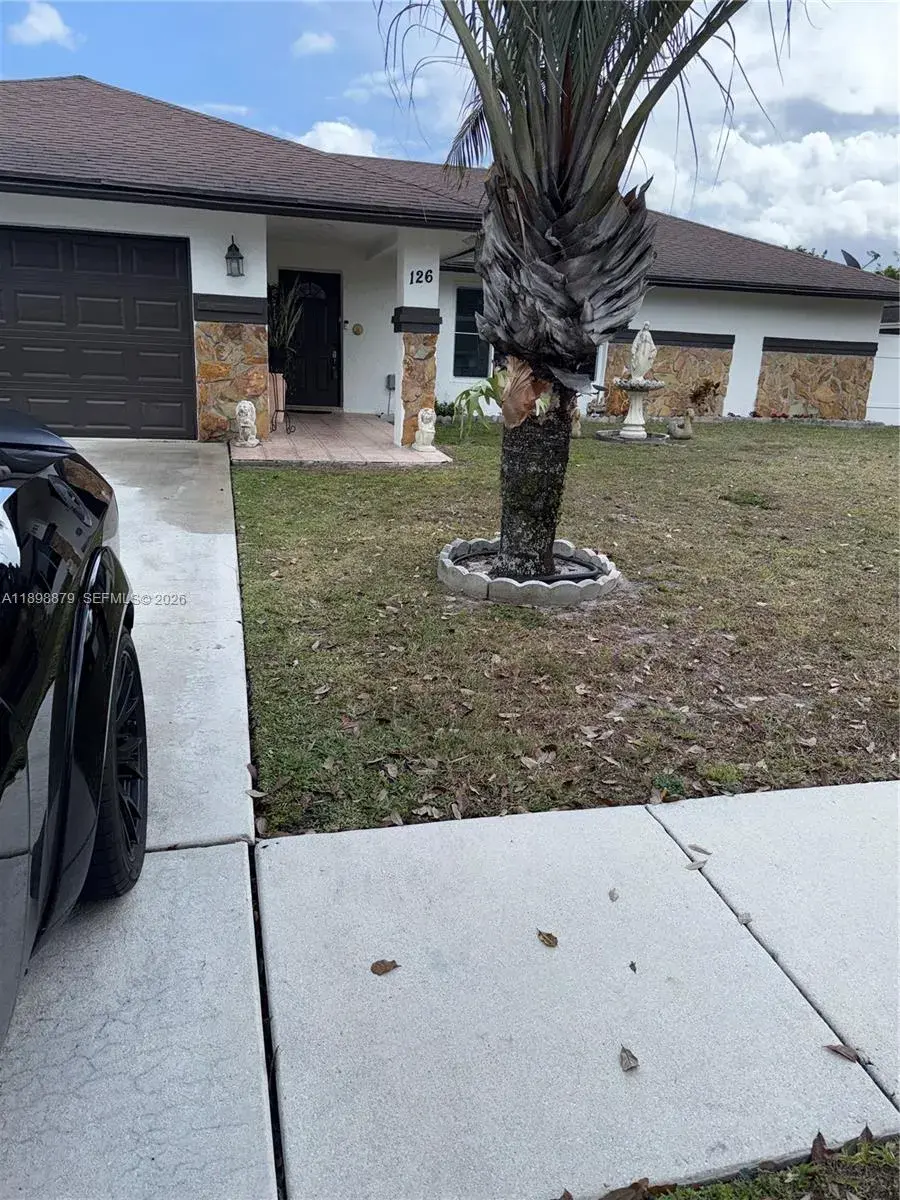 4 bedroom 2 bath Residential for sale at 126 Sunflower Cir, Royal Palm Beach FL 33411