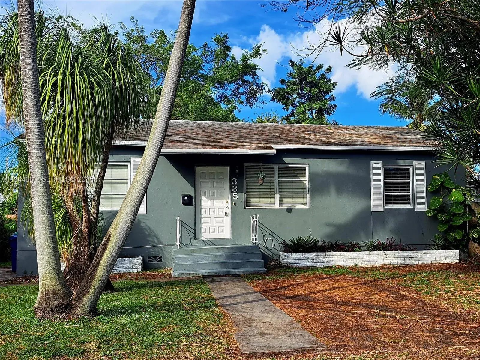 3 bedroom 2 bath Residential for sale at 335 NW 102nd St, Miami FL 33150
