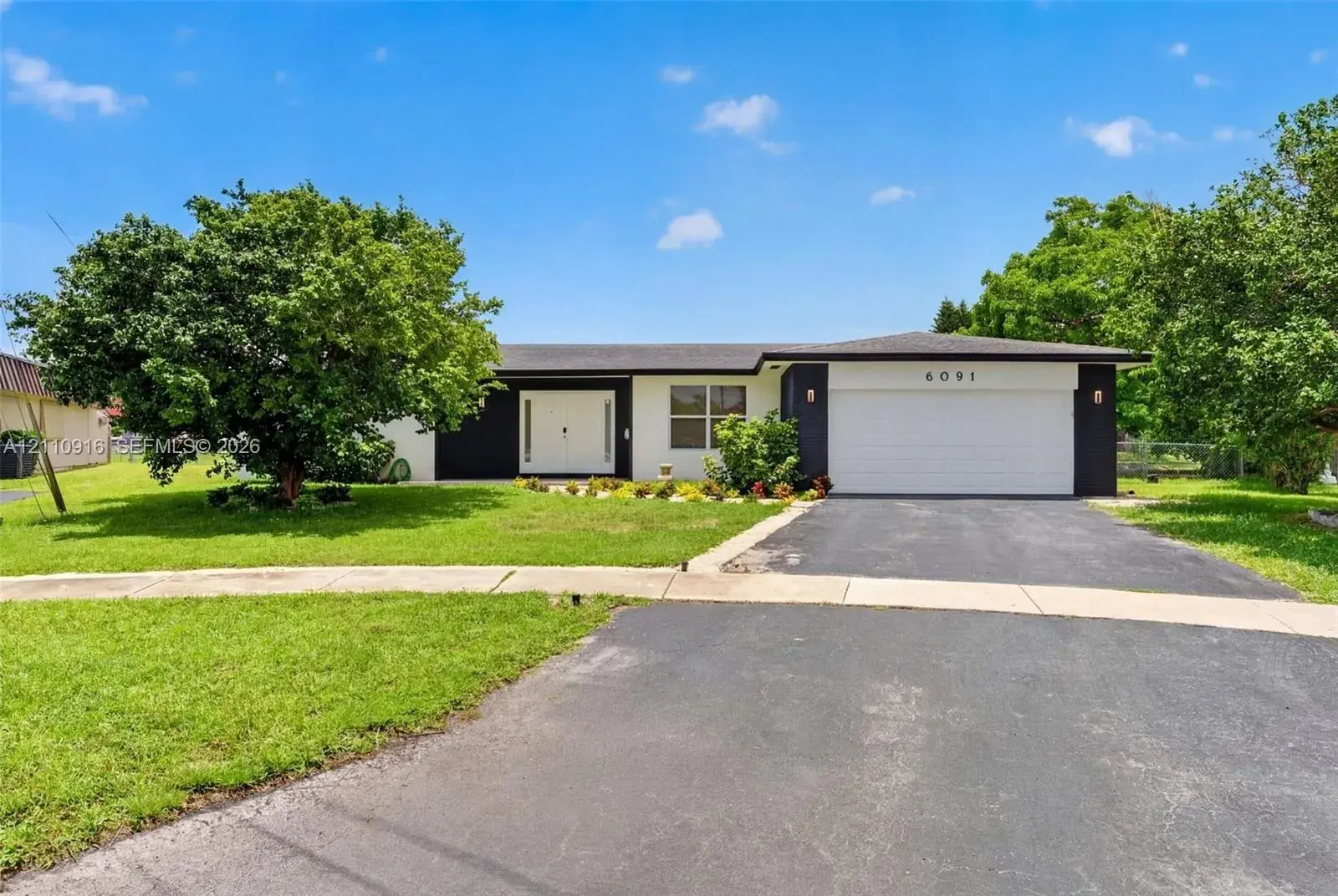 4 bedroom 2 bath Residential for sale at 6091 SW 14th St, Plantation FL 33317