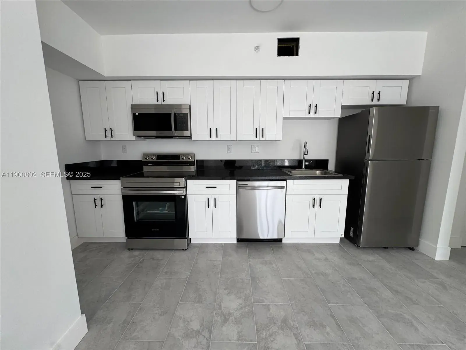 147 NW 59th St # 202, Miami FL 33127