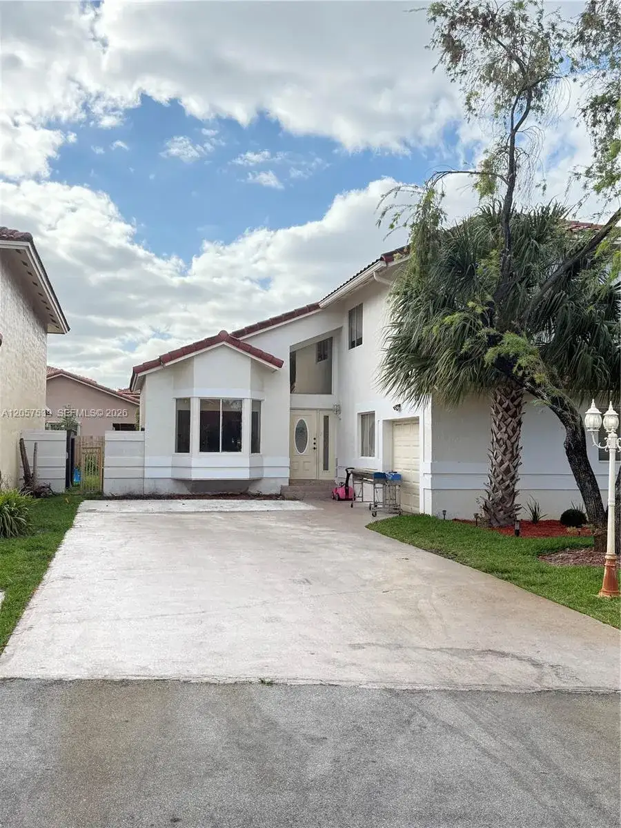 4 bedroom 3 bath Residential for sale at 18318 NW 61st Ct, Hialeah FL 33015
