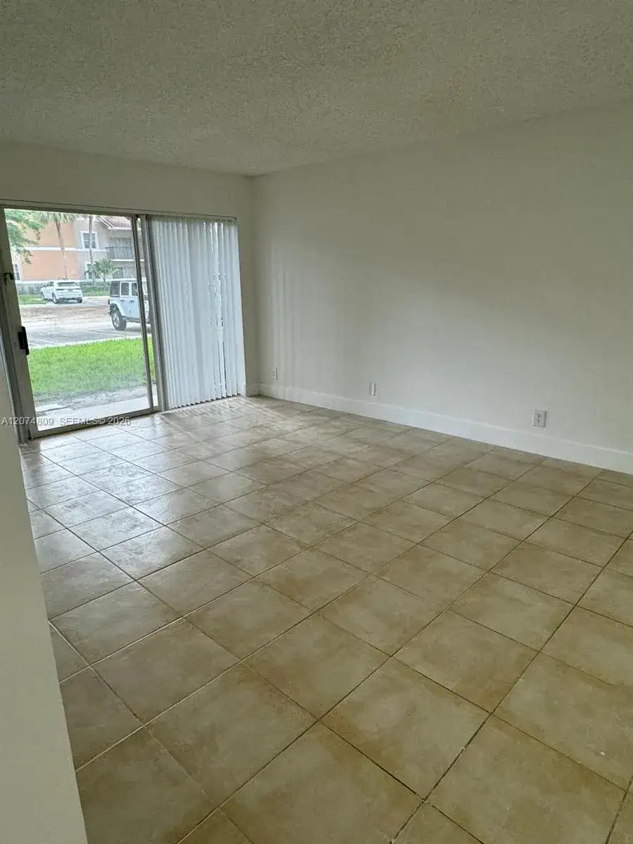 8801 Wiles Rd # 103, Coral Springs FL 33067 photo 2