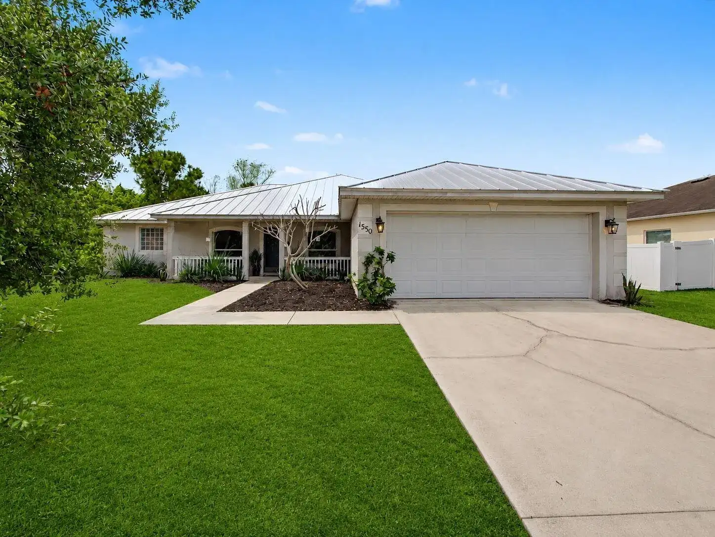 1550 SW Kosnar Avenue, Port St. Lucie FL 34953 photo 2