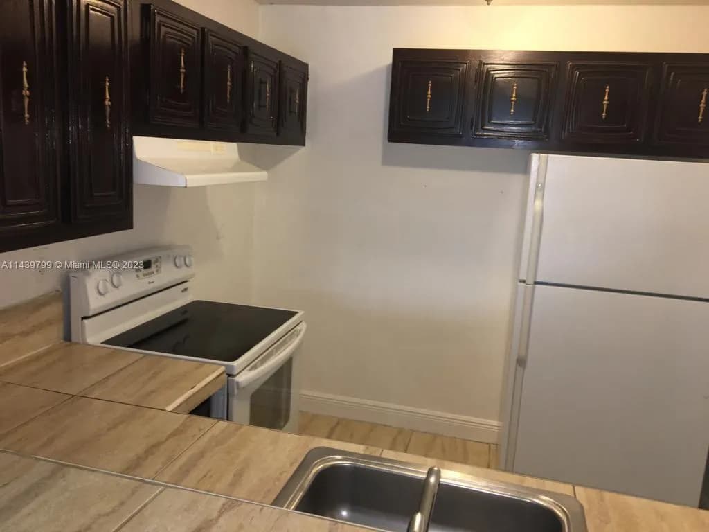 498 NW 165th St Rd # D205, Miami FL 33169