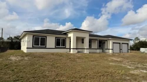 4 bedroom 3 bath for sale at 1715 McArthur Ave, Lehigh Acres FL 33972