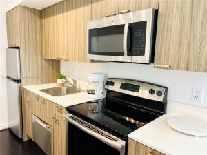 Luxury Living in Miami Beach’s Iconic Art Deco District: A Closer Look at 551 Michigan Ave #123 15 551 Michigan Ave 123 Miami Beach Kitchen 2