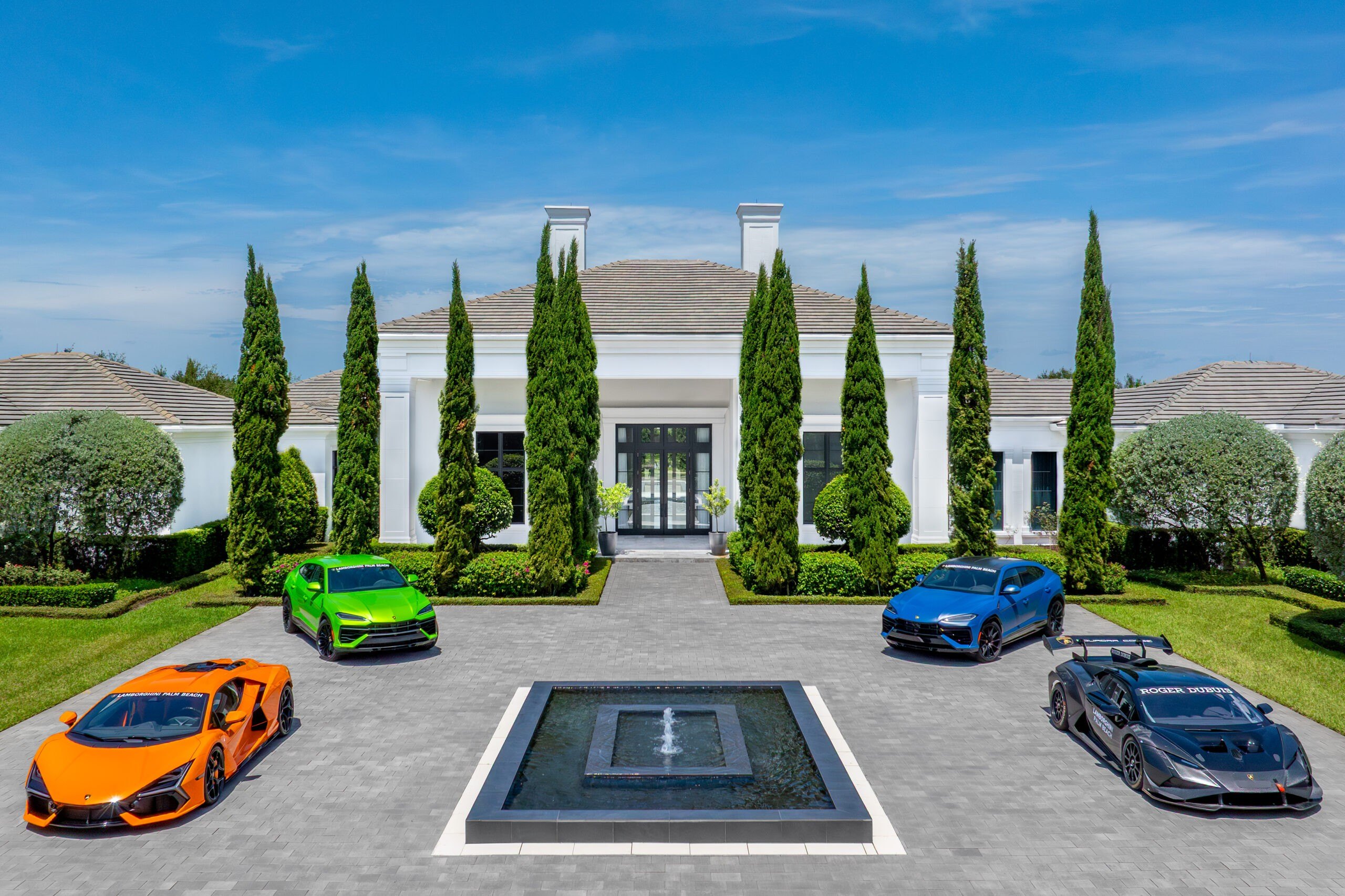 Luxury cars in front of a Florida Mansion next door to Mark Wahlberg