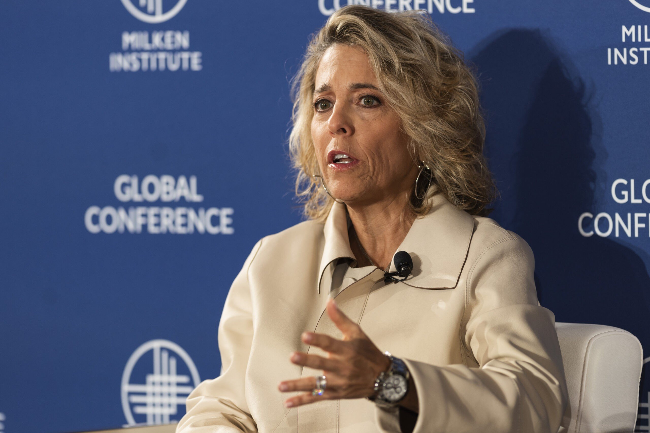 Pamela Liebman, chief executive officer or Corcoran Group in a luxurious coat. She is quoted saying People need to stop buying coffee to afford a home.