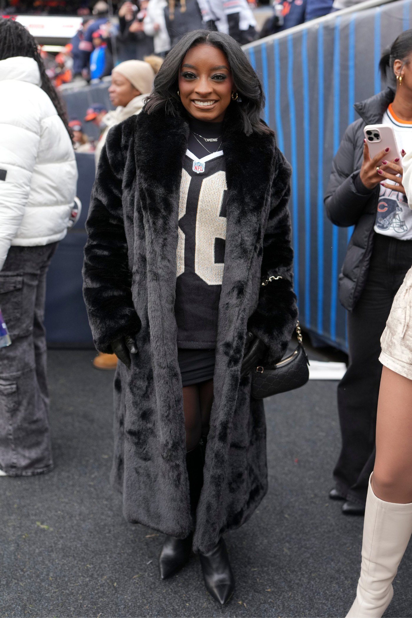 CHICAGO, ILLINOIS - NOVEMBER 9: Simone Biles on the sidelines prior to an NFL football game between the Chicago Bears and New York Giants at Solider Field on November 9, 2025 in Chicago, Illinois. (Photo by Todd Rosenberg/Getty Images)