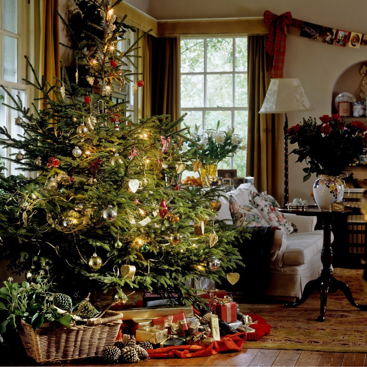 A Ralph Lauren inspired Christmas tree in a living room.